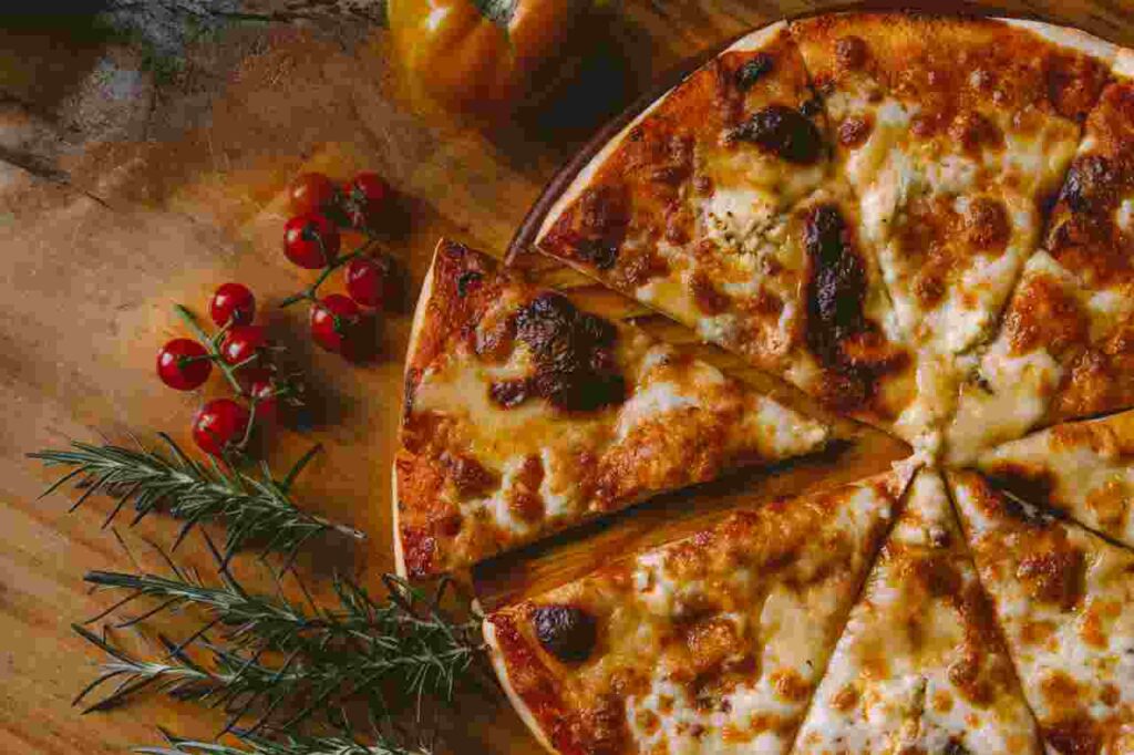 Slice of delicious pizza with melted cheese and toppings.