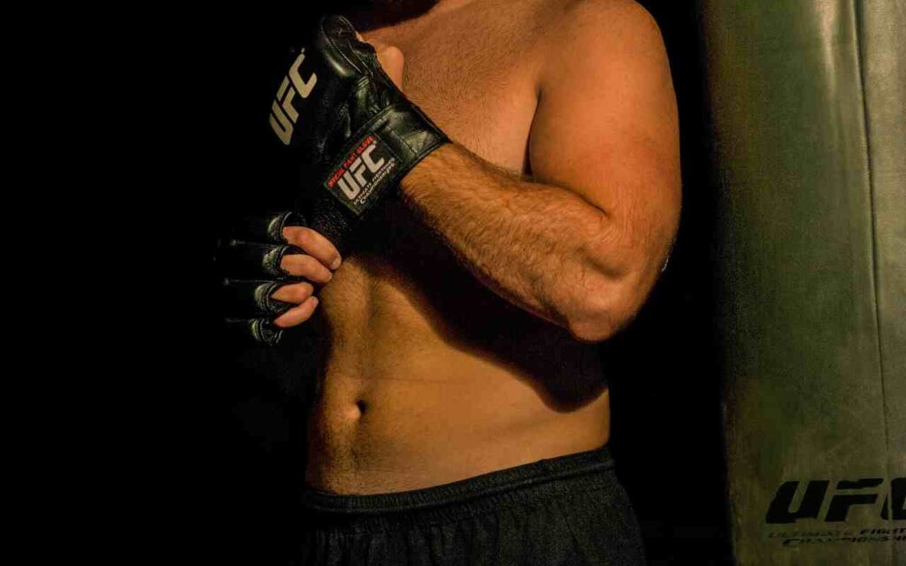 Two UFC fighters in intense battle inside the Octagon.