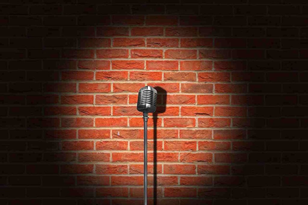 Collage of iconic comedians sharing laughter on stage.