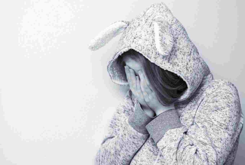 "Illustration depicting signs of low self-esteem in women within relationships."