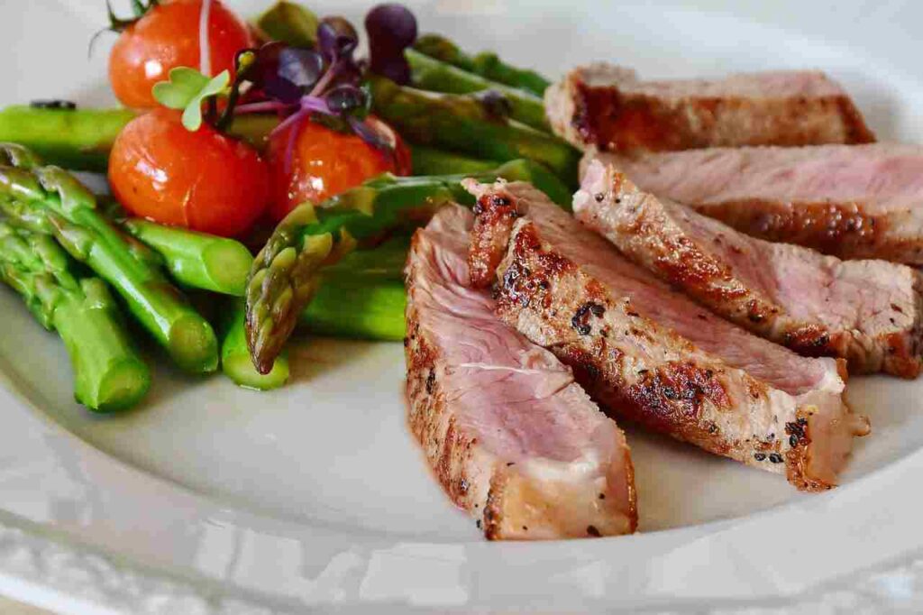 Image of a balanced meal with protein, whole grains, and vegetables.