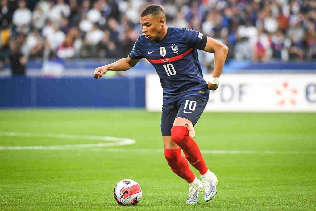 Kylian Mbappé in action on the soccer field.