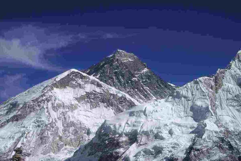 A breathtaking image of Mount Everest, the world's tallest mountain, shrouded in snow and clouds.