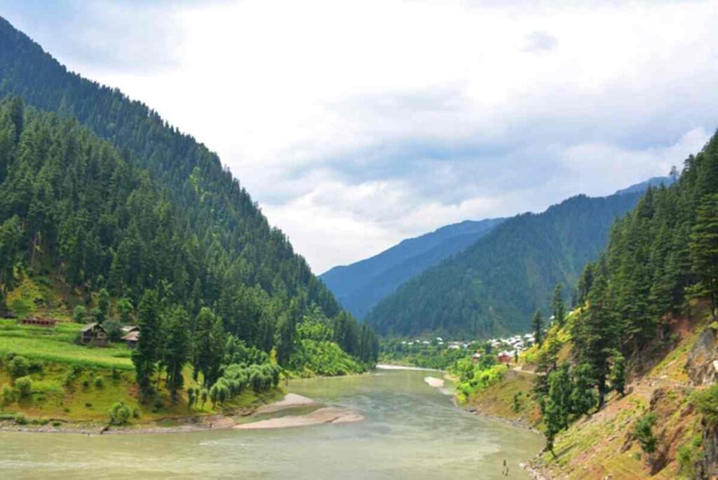 A stunning photograph showcasing the breathtaking beauty of Pakistan, featuring lush green landscapes, majestic mountains, and vibrant cultural elements.