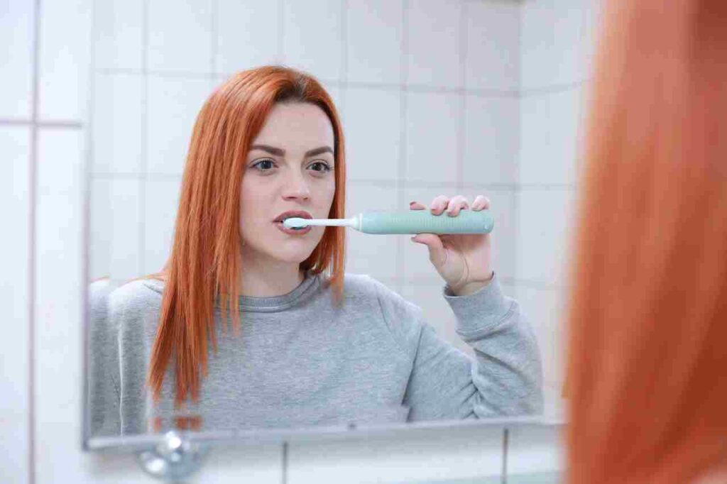 A toothbrush and dental floss, essential tools for oral care.