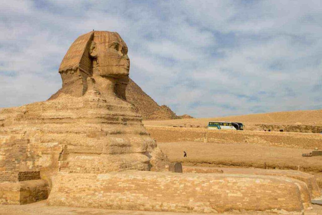 Awe-inspiring Egyptian Pyramids standing tall against a clear blue sky, showcasing the ancient architectural wonders of Egypt