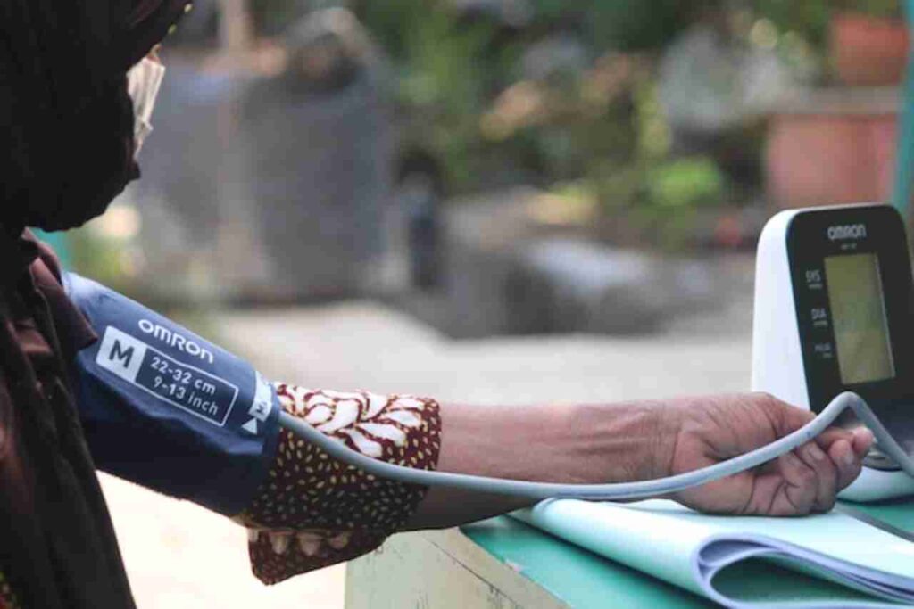 "Person measuring blood pressure"