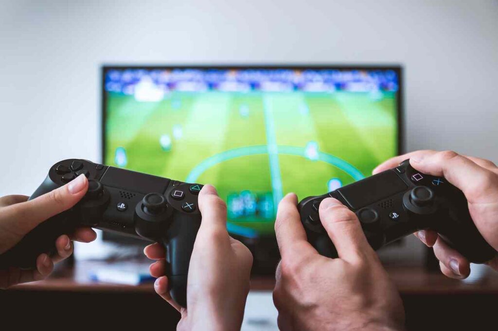 Image of a video game controller with fireworks exploding around it.