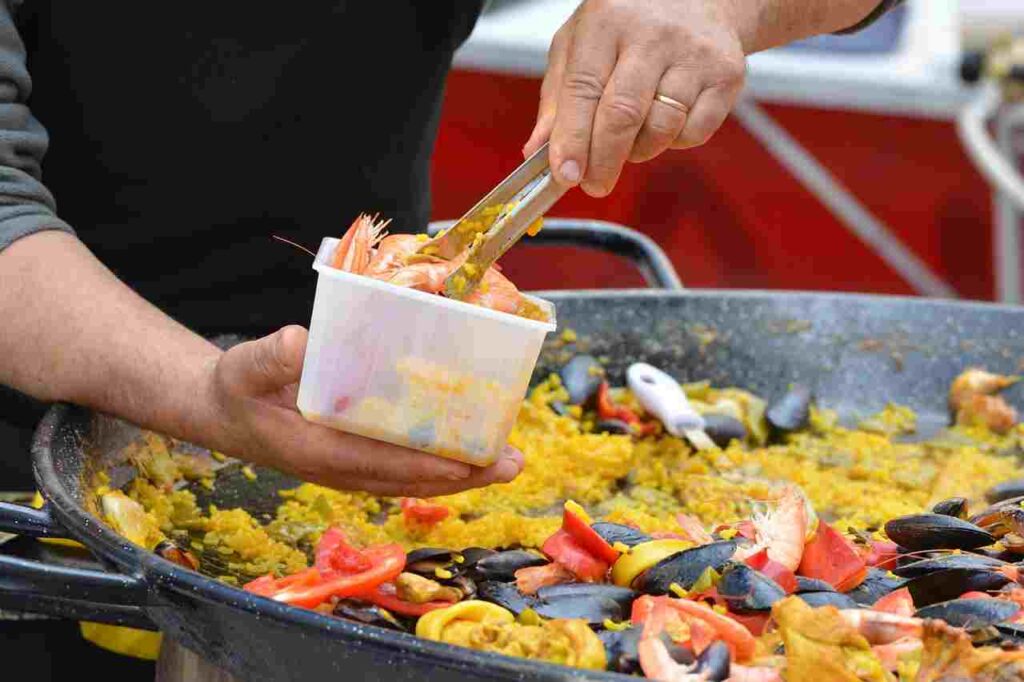 Delicious paella in a traditional pan.