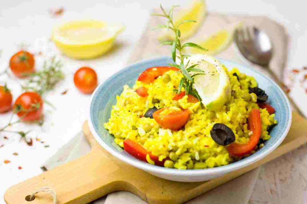 Delicious paella in a traditional pan.