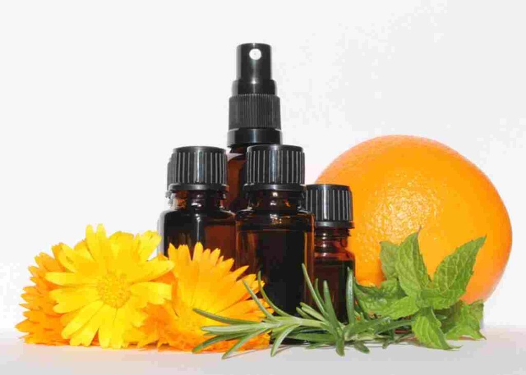 Image of peppermint leaves and essential oil bottle representing peppermint oil's health benefits.