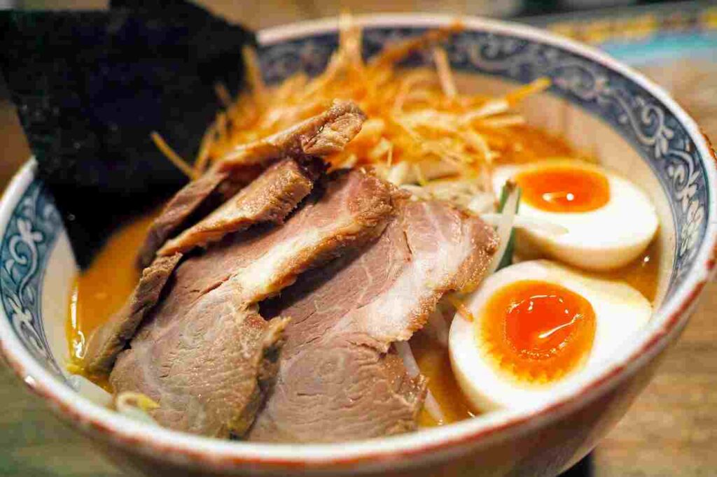 Delicious bowl of ramen with assorted toppings.