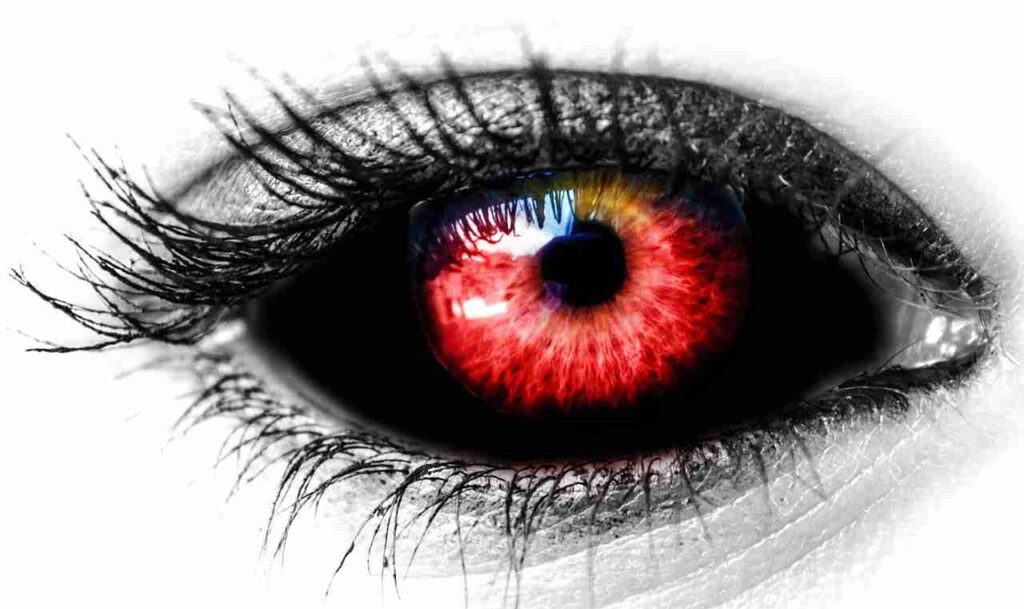 "Image of vampires fangs and blood against a dark background."