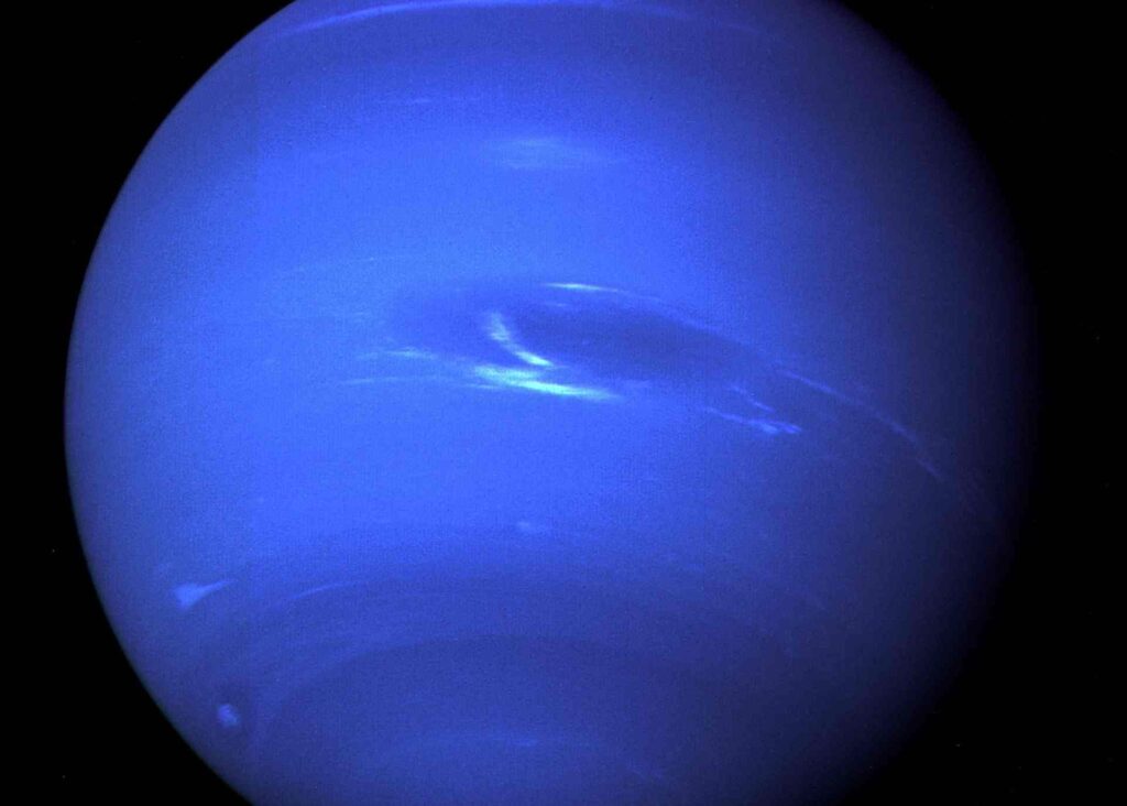 "Image: Neptune, the blue-hued planet with swirling clouds"