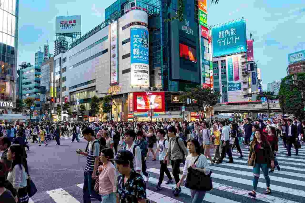 Tokyo city skyline at sunset, a bustling metropolis with modern architecture and vibrant city lights.