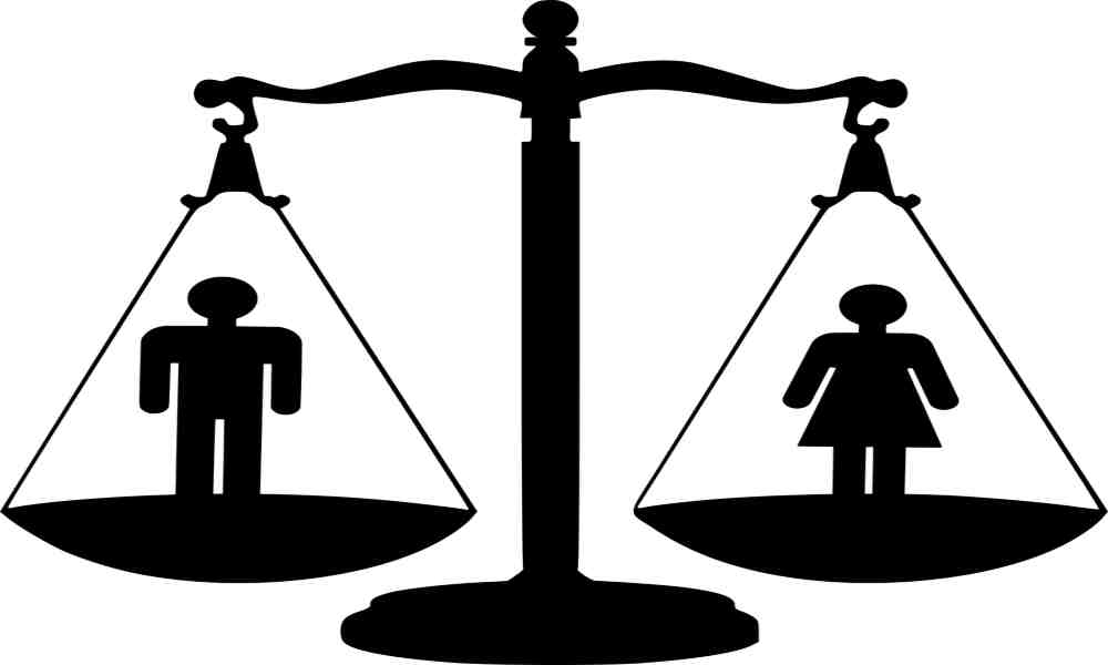 Silhouette of diverse women joining hands in unity and strength.