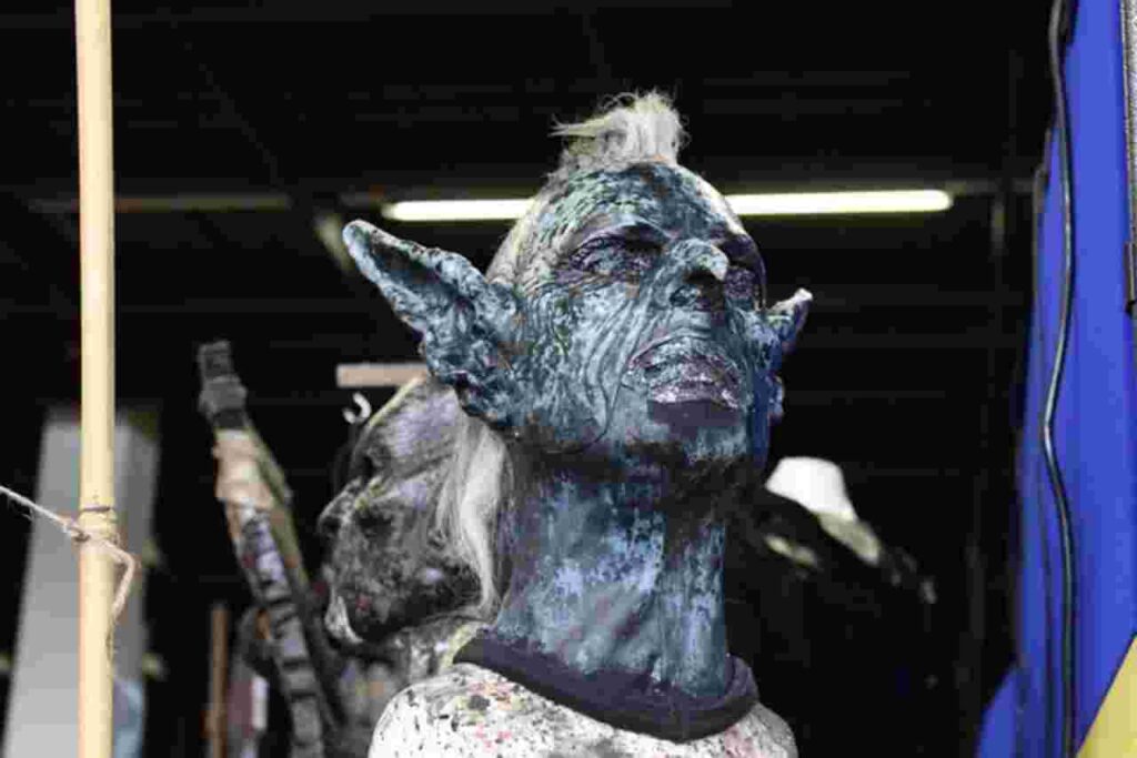 "Wizard facing off against an orc."