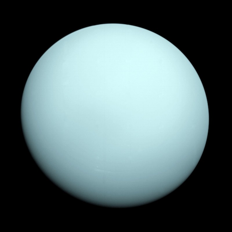 "Image: Uranus, the pale blue planet with a distinct tilt"