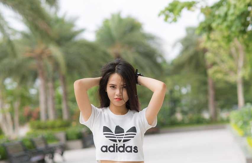 A pair of Adidas sneakers with the iconic three stripes, symbolizing style and innovation.