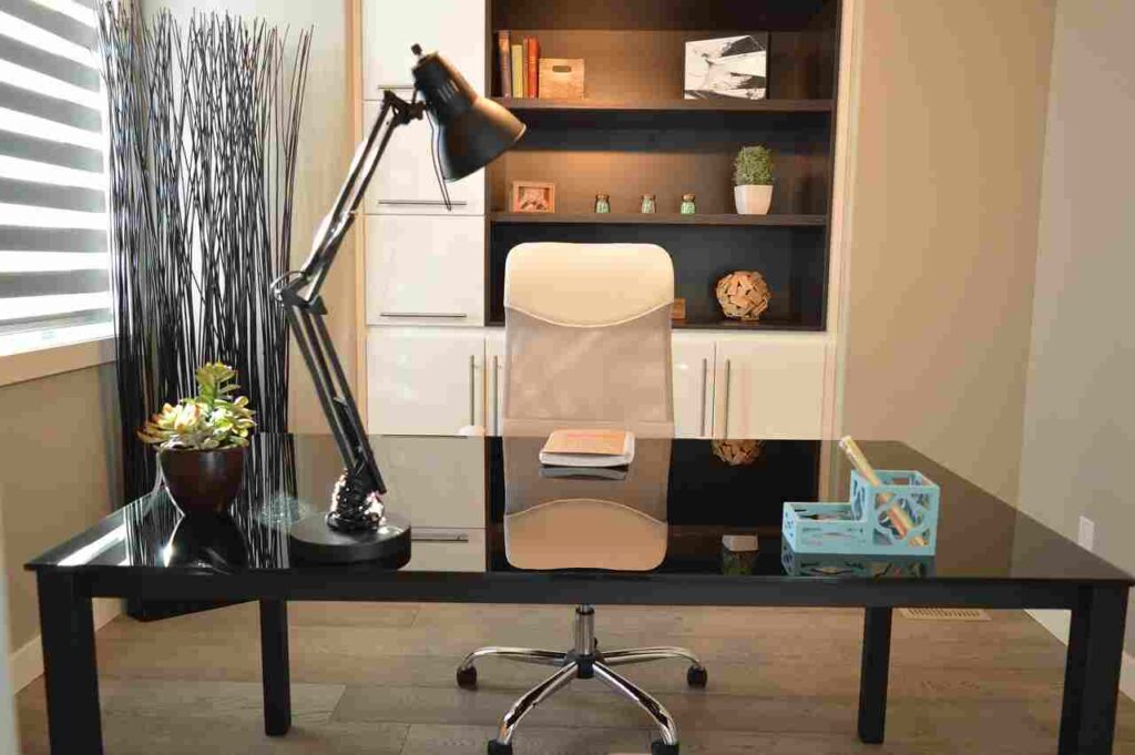 Optimized home office with laptop, plants, and ergonomic chair.