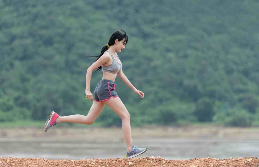 Healthy lifestyle concept: fruits, vegetables, and exercise equipment.