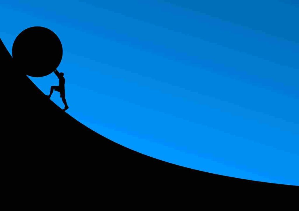 A person standing strong, facing challenges with determination and resilience.