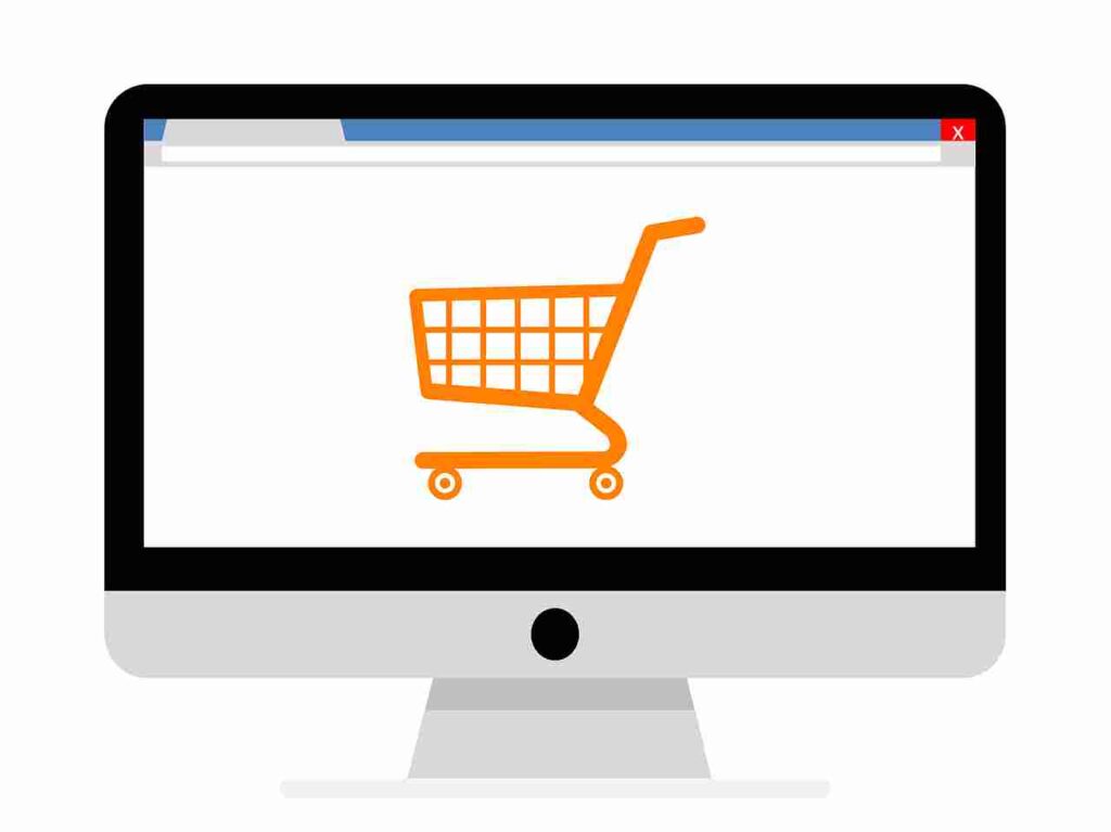 Image of a laptop with a shopping cart icon on the screen.
