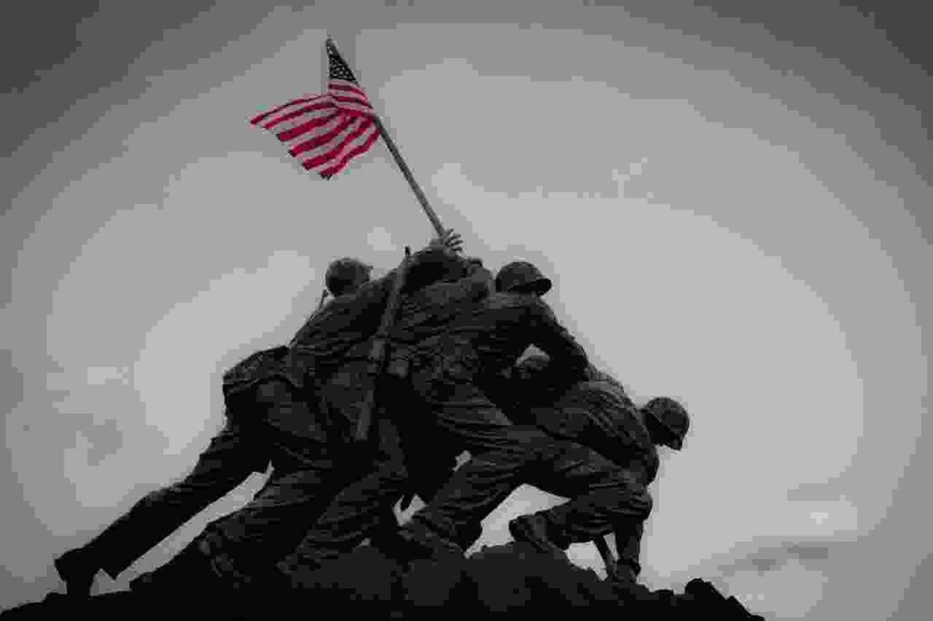 Vintage black and white photo of World War II soldiers in action.