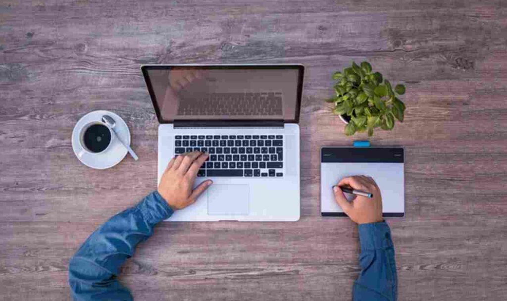 "Image: A laptop and money symbolizing online income opportunities."