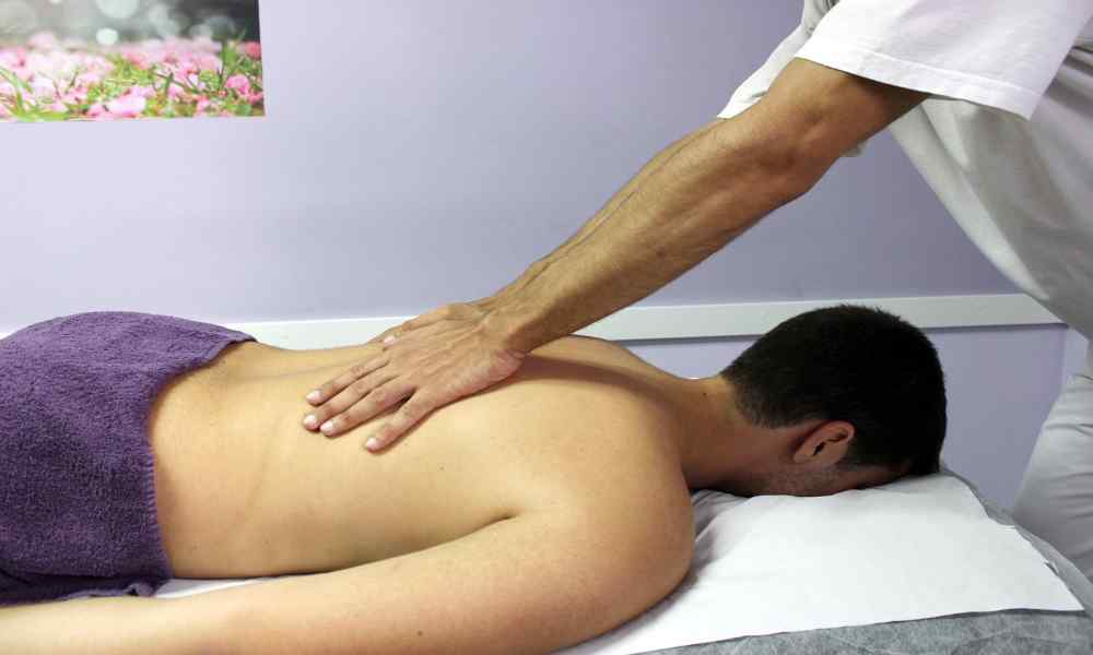 Image of a person giving a relaxing back massage.