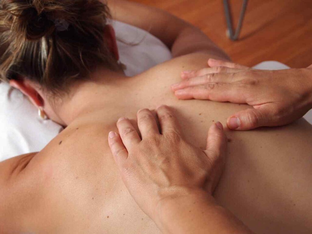 Image of a person giving a relaxing back massage.
