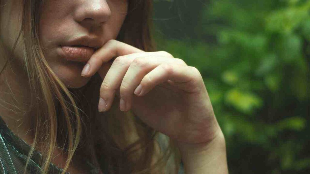 Close-up of a soothing lip balm, a key remedy in healing lip burns.