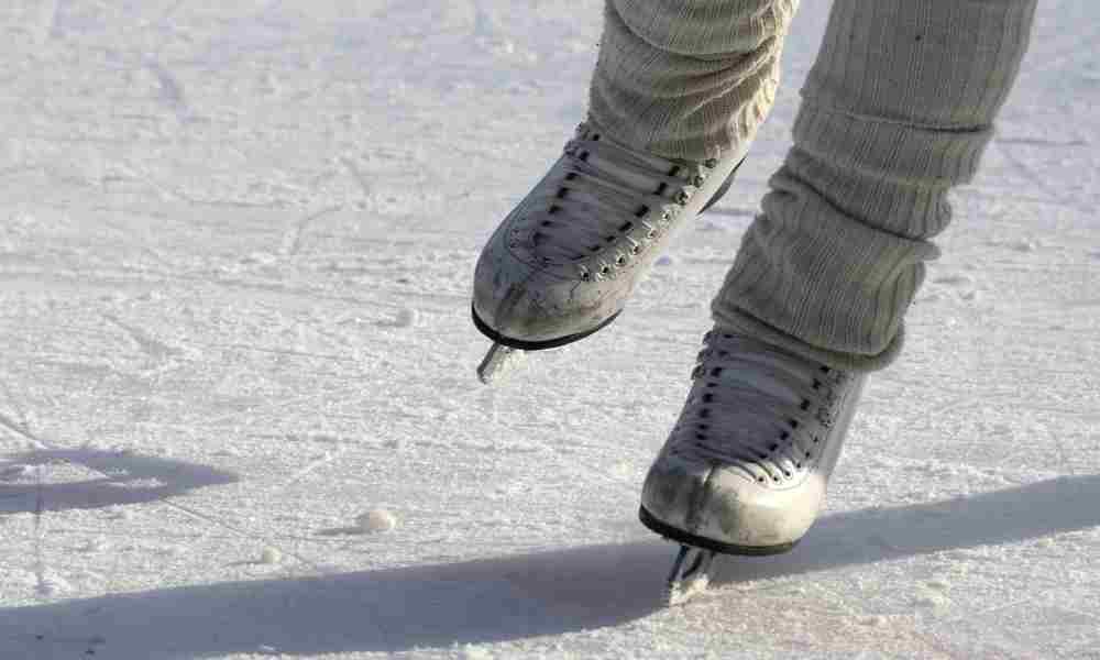 How to Ice Skating : Ice skates gliding gracefully on an icy surface, capturing the essence of the 'How to Ice Skate' guide.