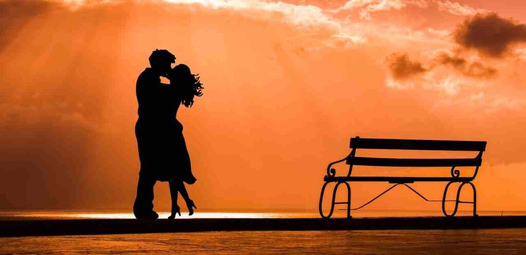A couple sharing a tender kiss, expressing love and intimacy.
