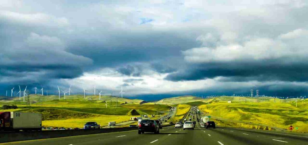 Open road with mountains in the distance - perfect for an American road trip adventure!