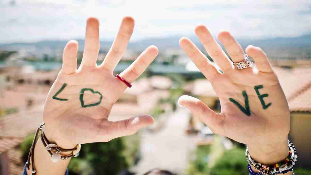 Image depicting two hands reaching out for each other, symbolizing empathy and connection.
