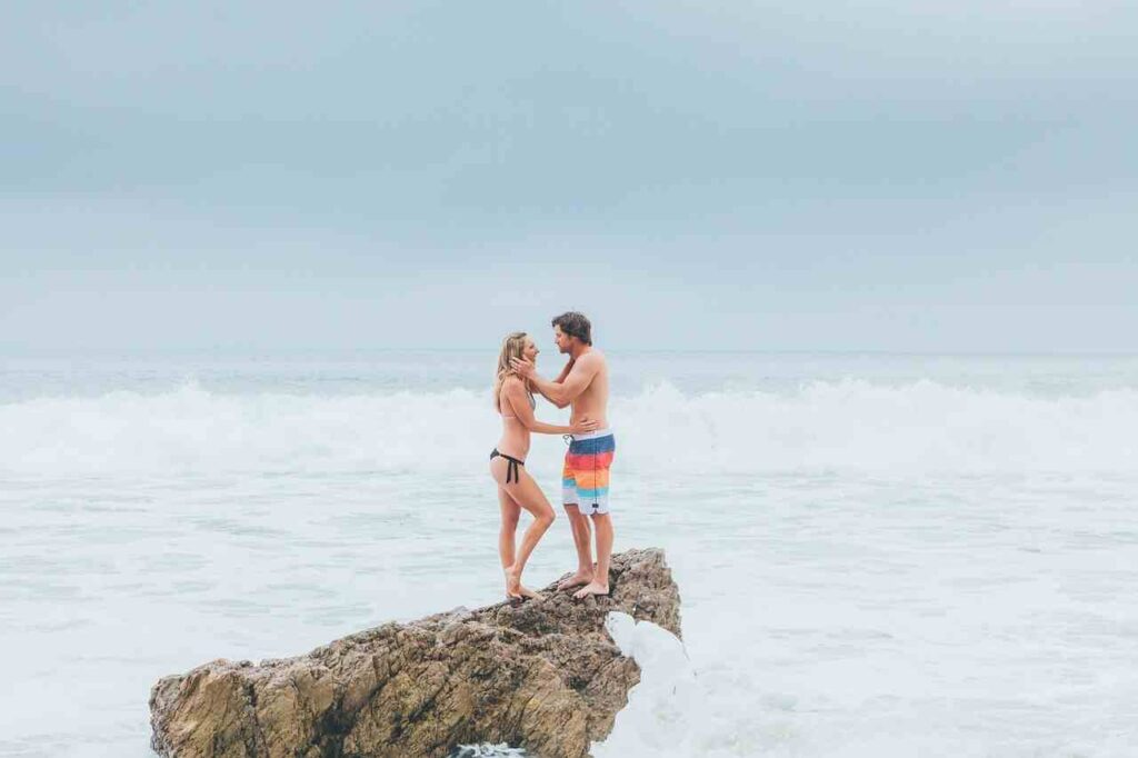 Happy couple holding hands, symbolizing a strong relationship and love.
