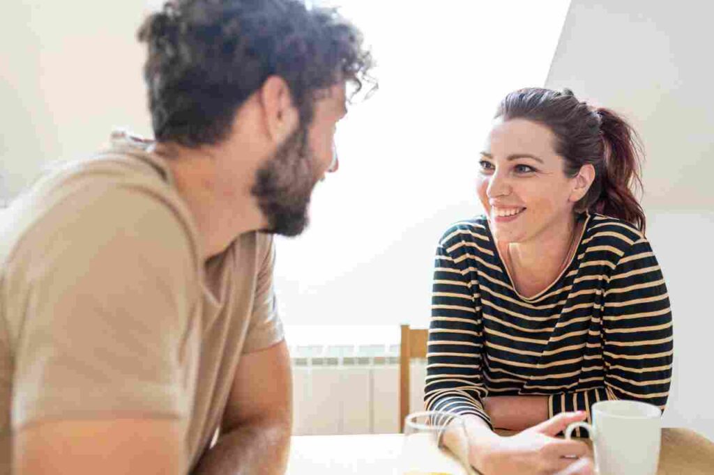 "Image showing two people engaged in deep conversation, highlighting the transformative power of effective listening in relationships