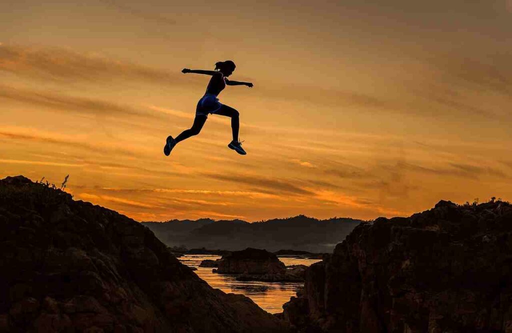 Become an athlete - a person jogging on a track, symbolizing the journey to athletic success.