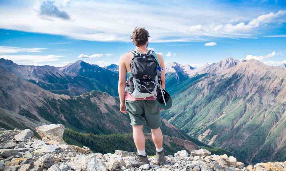 World map with diverse landmarks and a backpack, symbolizing exploration and travel.