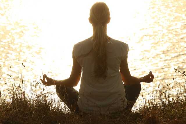 A woman practicing mindfulness, enjoying a moment of serenity amidst nature. How to Feel Good