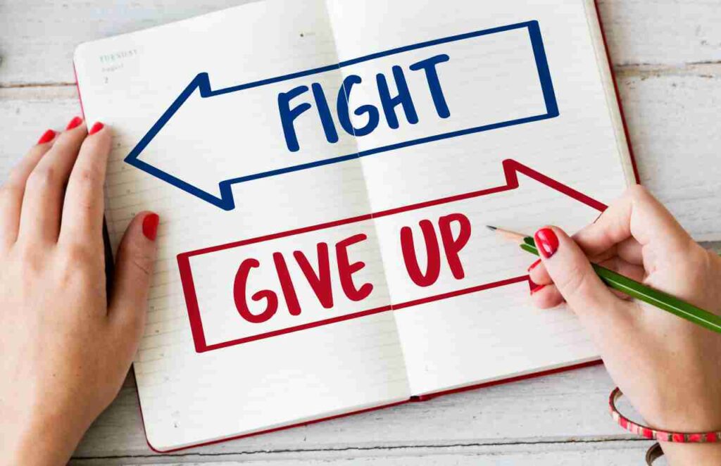 Overcoming the Urge to Give Up. Image showing a person climbing a steep mountain, symbolizing perseverance and determination.